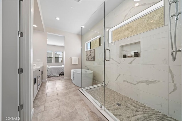 bathroom with tile patterned floors, vanity, and independent shower and bath