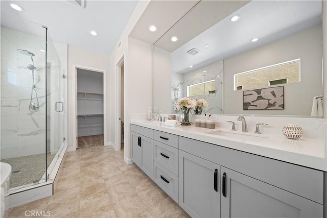 bathroom featuring vanity and a shower with shower door