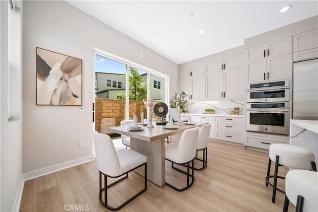 dining space featuring light hardwood / wood-style flooring