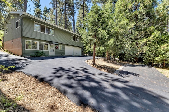 front of property with a garage