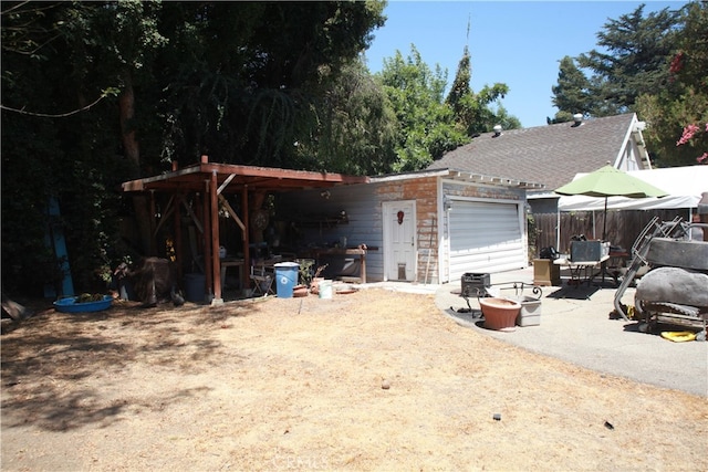 exterior space with a patio and an outdoor fire pit