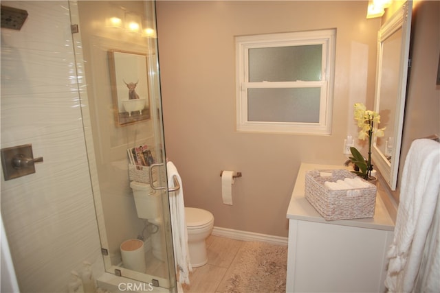 bathroom with an enclosed shower, vanity, and toilet