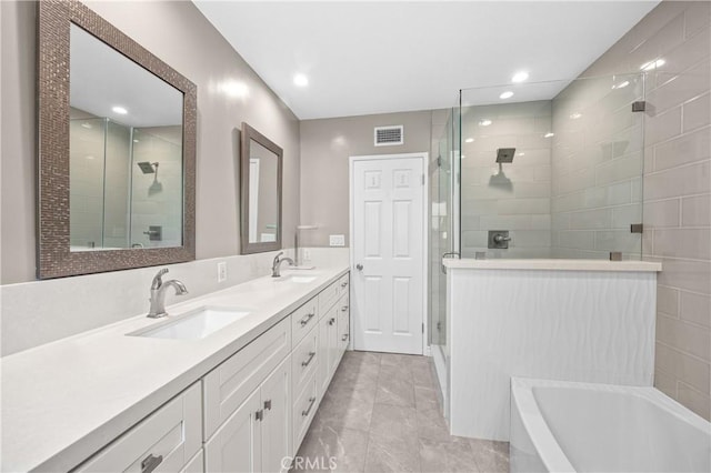 bathroom featuring a shower stall, visible vents, and a sink