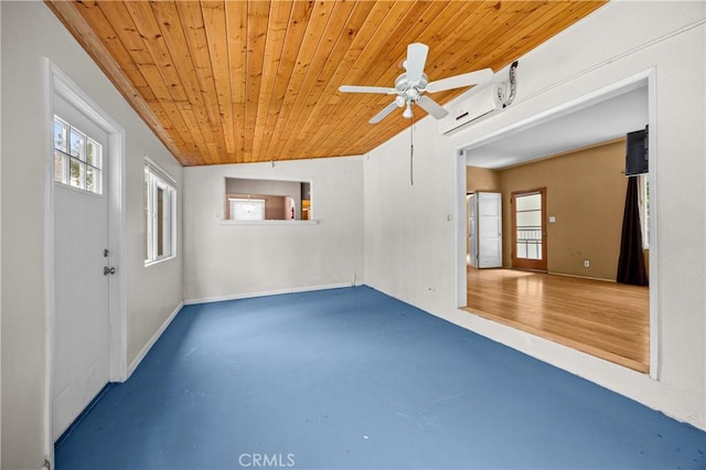 spare room with wood ceiling, a wealth of natural light, a ceiling fan, and a wall mounted AC