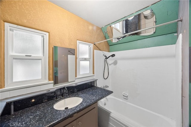 bathroom featuring vanity and bathing tub / shower combination