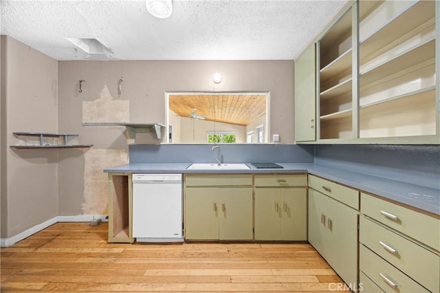 kitchen featuring light wood-type flooring, white dishwasher, a sink, and a textured ceiling
