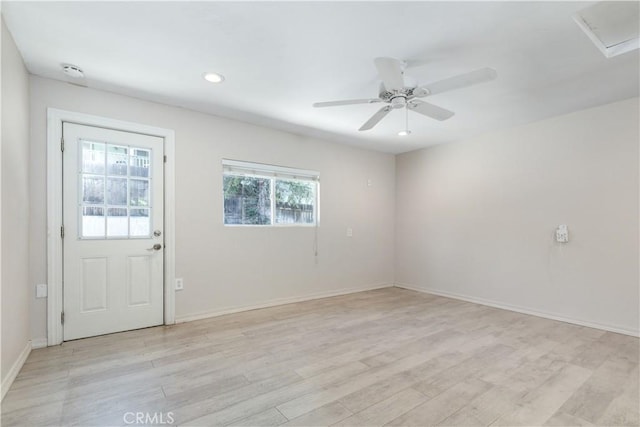 unfurnished room featuring ceiling fan and light wood-type flooring