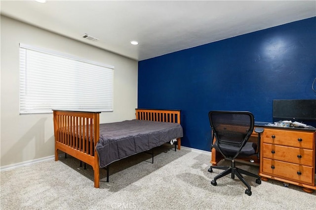 bedroom with light colored carpet