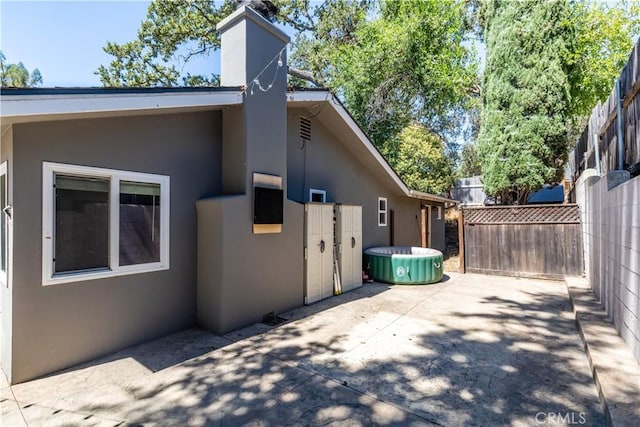 view of property exterior featuring a patio