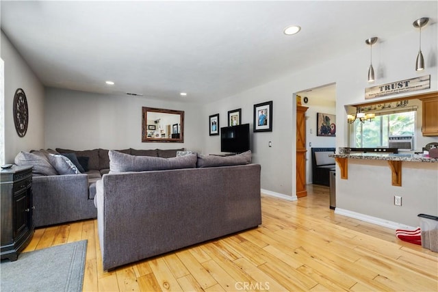 living room with light hardwood / wood-style floors