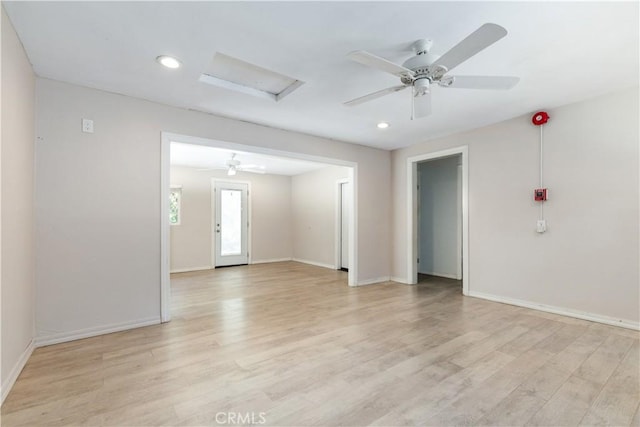 spare room featuring ceiling fan and light hardwood / wood-style floors