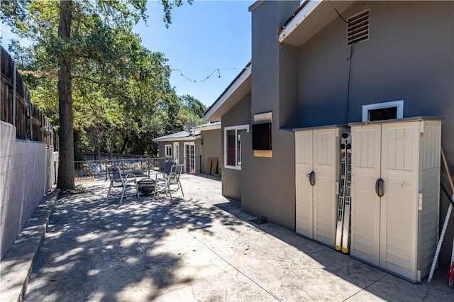 view of side of property featuring a patio