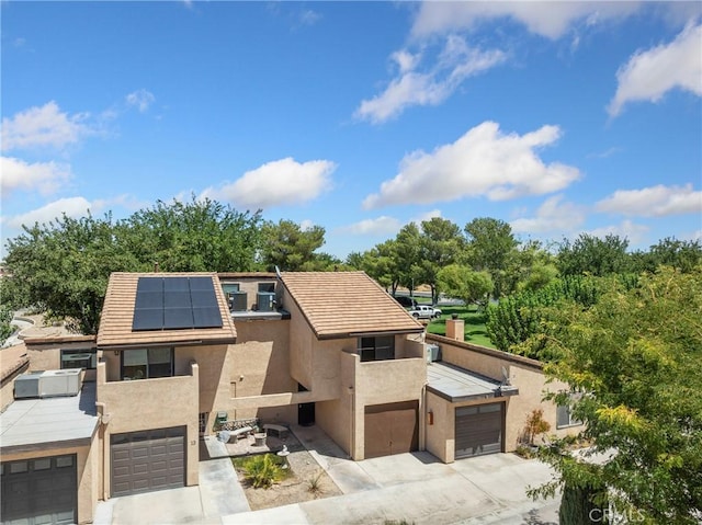 view of front of house featuring solar panels