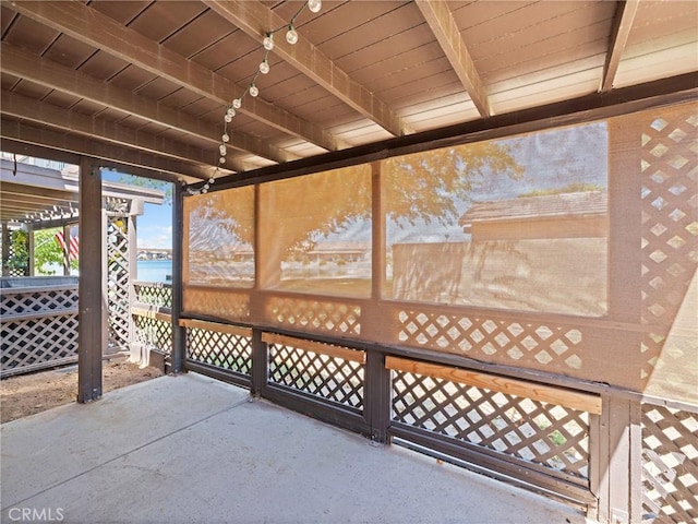 view of patio featuring a water view and a pergola