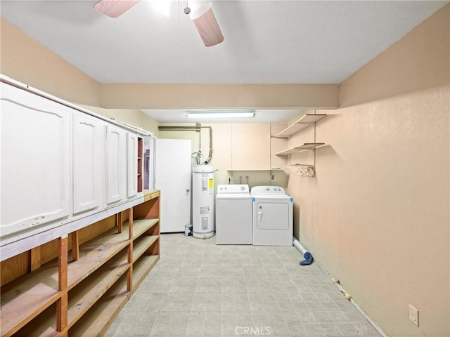 laundry room featuring cabinets, ceiling fan, electric water heater, and washer and clothes dryer