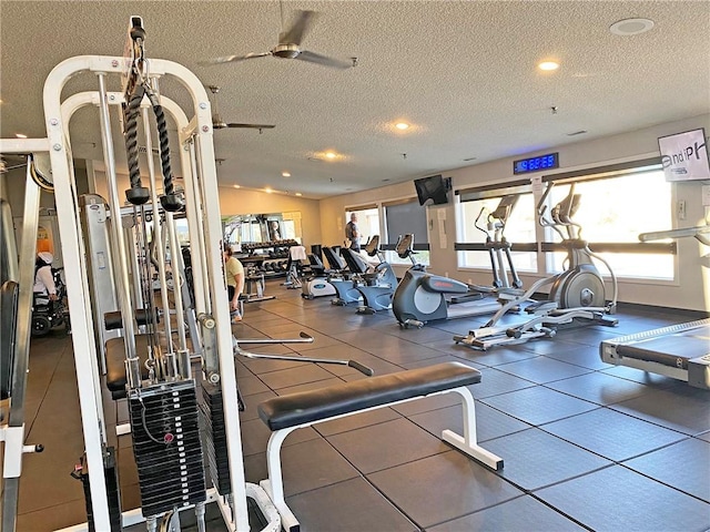 gym with lofted ceiling and a textured ceiling