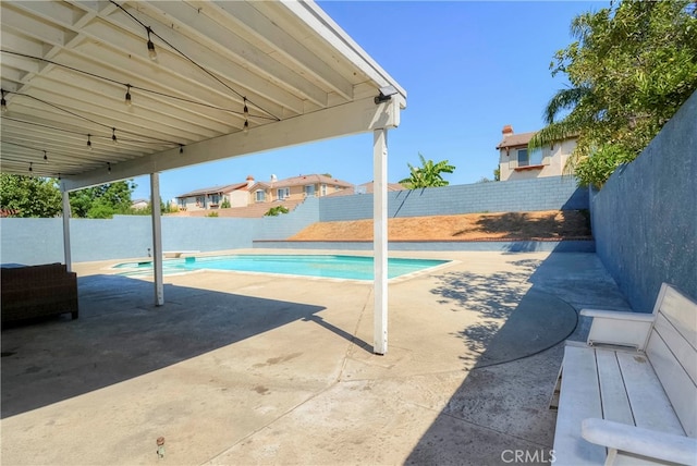 view of swimming pool with a patio