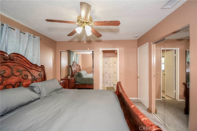 bedroom with ceiling fan, a textured ceiling, carpet floors, and ensuite bathroom