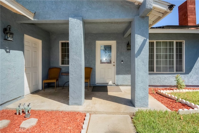 doorway to property with a patio