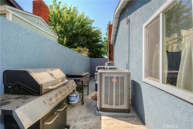 view of patio / terrace featuring central AC and a grill