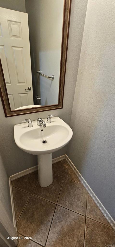 bathroom featuring tile patterned flooring