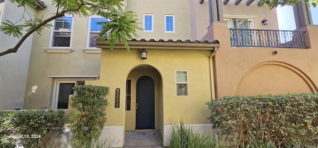 property entrance with a balcony