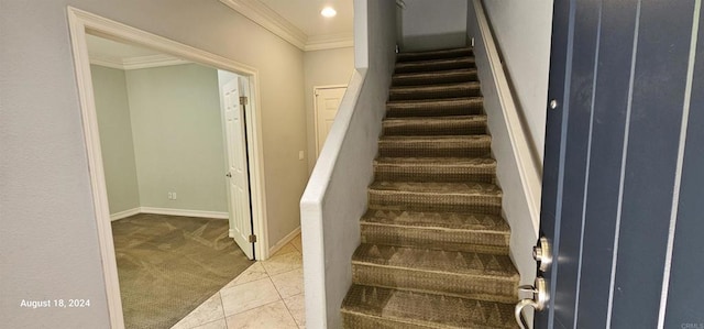 stairs featuring carpet floors and crown molding