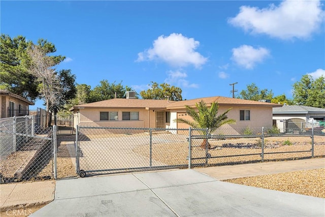 ranch-style house featuring central AC unit