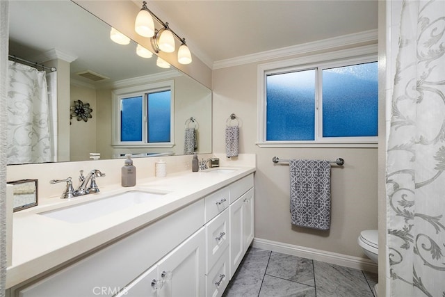 bathroom featuring vanity, toilet, and crown molding