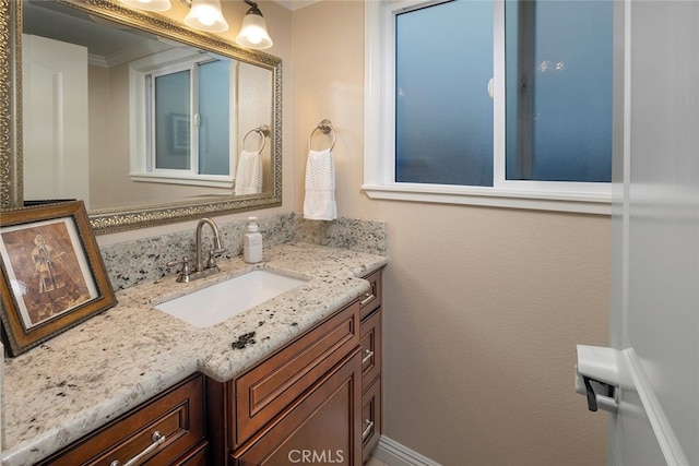 bathroom featuring vanity and crown molding