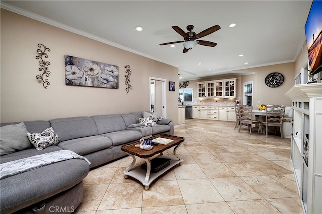 tiled living room featuring ceiling fan and ornamental molding