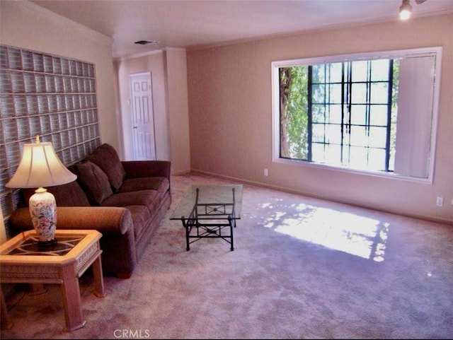 living room with carpet flooring and ornamental molding