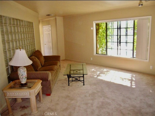 living room featuring light carpet and crown molding