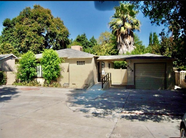 ranch-style house featuring a garage