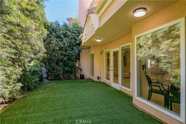 view of yard with french doors