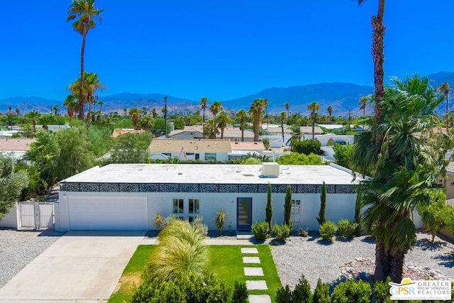 view of front of house featuring a mountain view and a garage