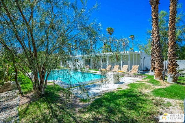 view of pool featuring a patio area