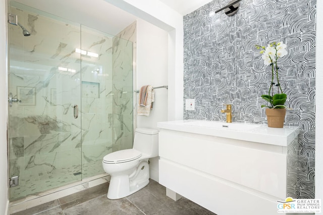 bathroom featuring vanity, toilet, walk in shower, and tile patterned flooring