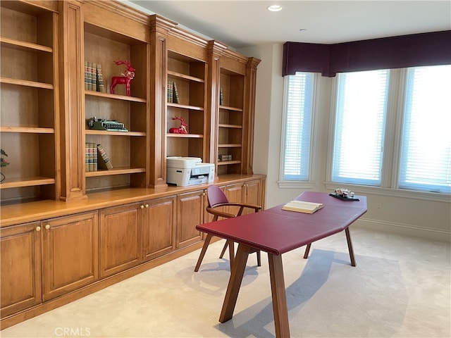 office area with light colored carpet