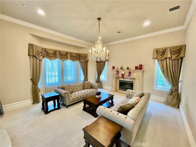 carpeted living room with crown molding, a healthy amount of sunlight, and a notable chandelier