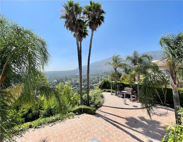 view of patio / terrace featuring a mountain view