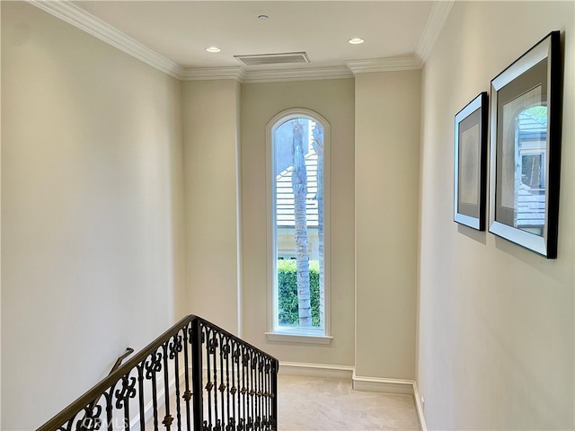 interior space with ornamental molding and carpet flooring