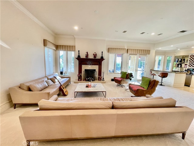 carpeted living room with ornamental molding