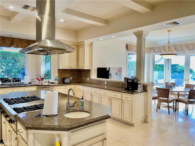 kitchen featuring island range hood, sink, a kitchen island with sink, and stainless steel gas cooktop