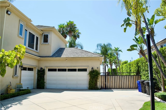 view of side of property featuring a garage