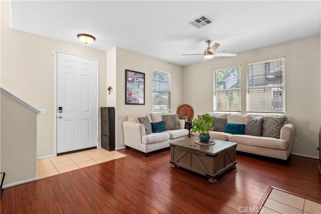 living room with ceiling fan and hardwood / wood-style flooring