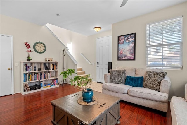 living room featuring ceiling fan and wood-type flooring