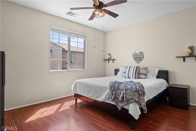 bedroom featuring ceiling fan and dark wood-type flooring