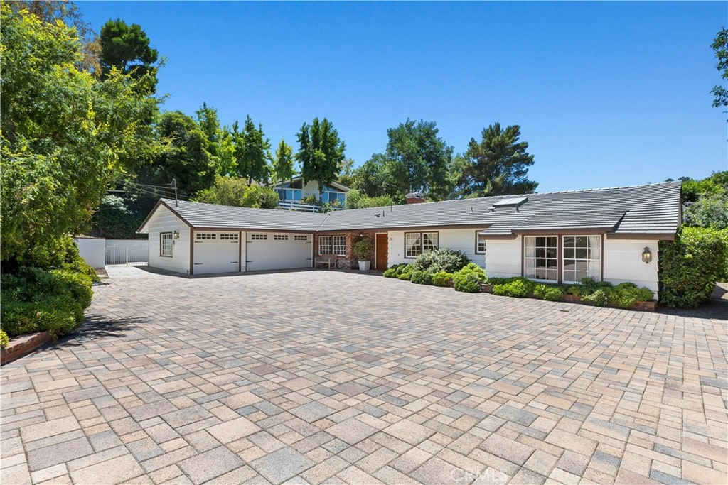 ranch-style house featuring a garage