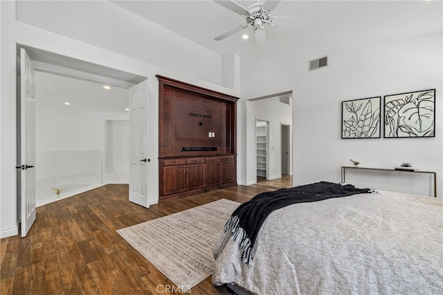 bedroom featuring dark hardwood / wood-style flooring and ceiling fan